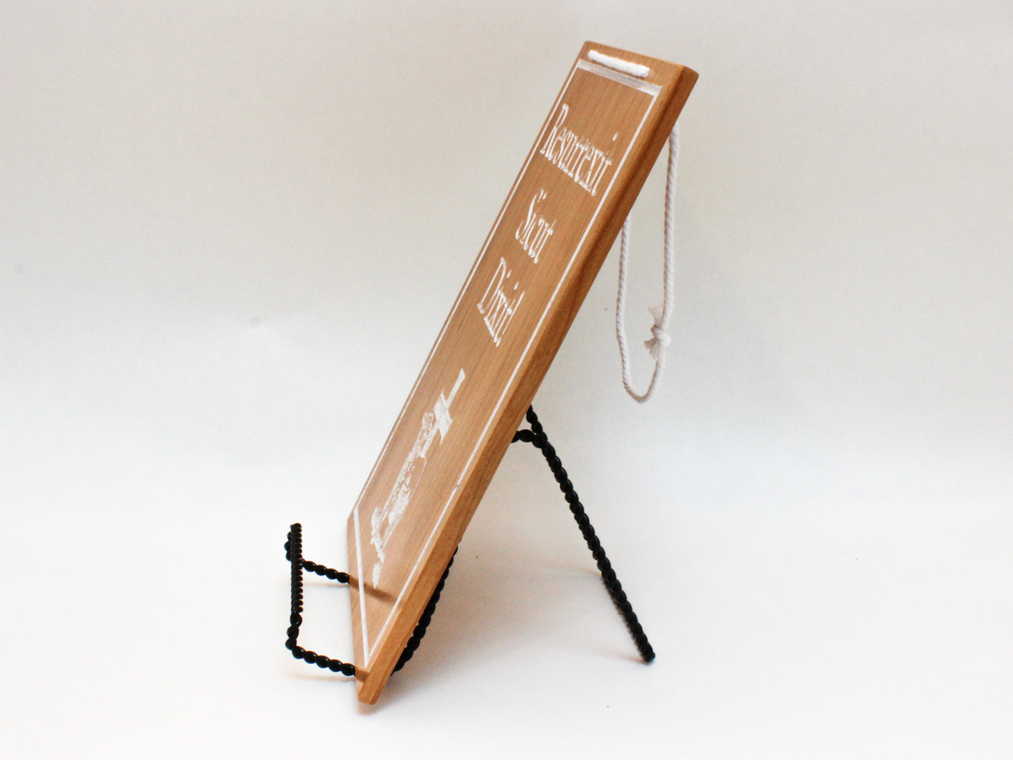 Side view of hanging sign to show thinness and hanging cord. Reversible Easter/Lent sign