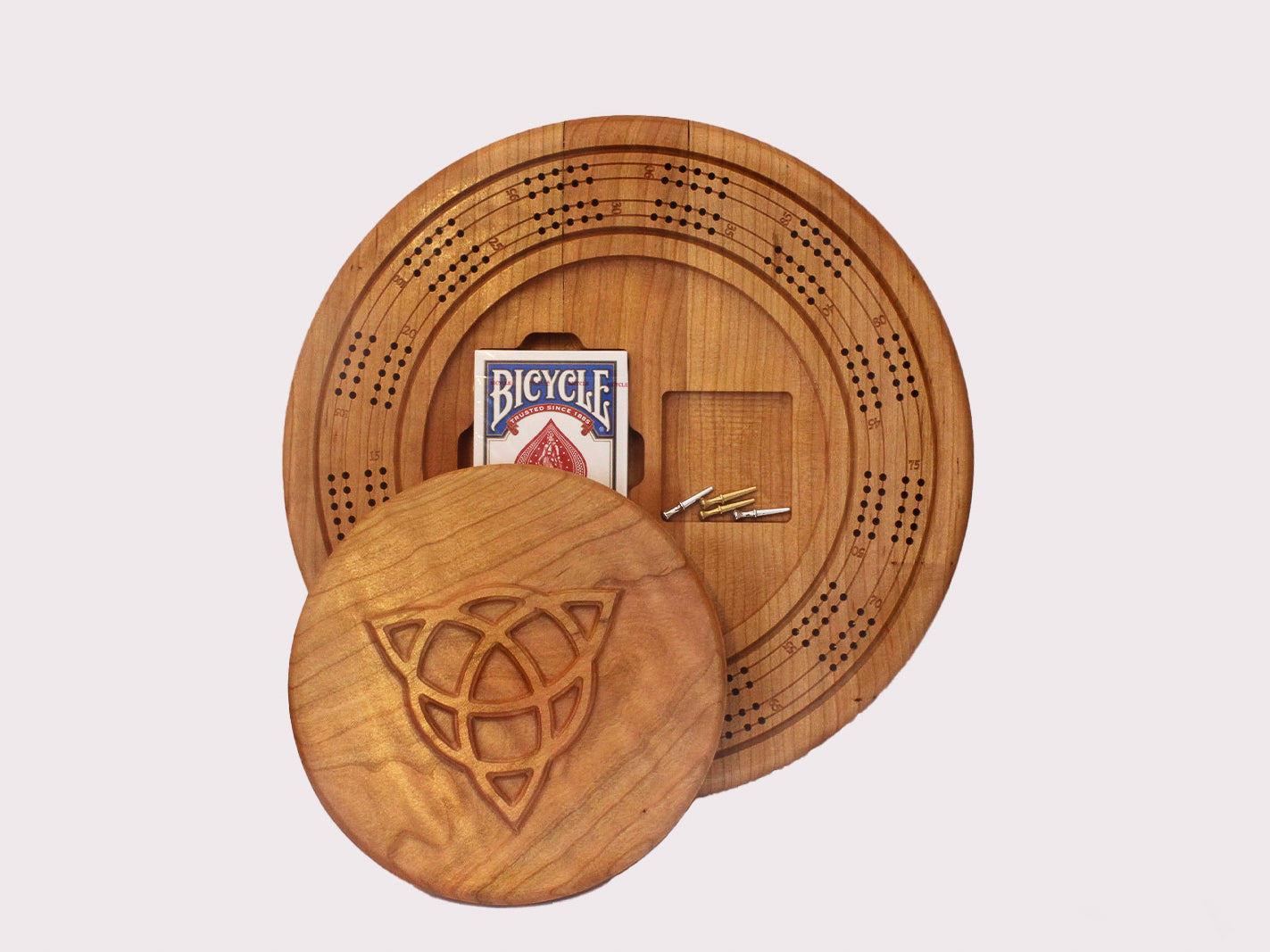 Wooden cribbage board: round cribbage game with storage for cards and pins. Made of beautiful cherry wood.