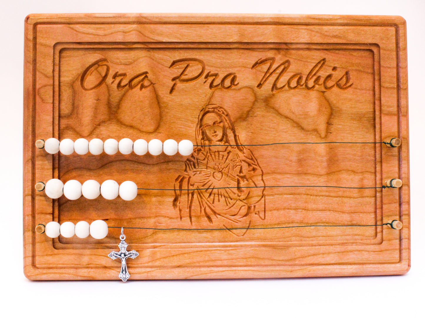 Handmade wooden kitchen rosary engraved with an image of The Blessed Virgin Mary and featuring the text Ora Pro Nobis, which is Latin for Pray for Us.