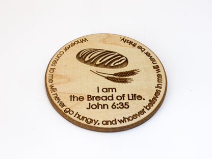 Wood coaster featuring image of a loaf of bread and wheat, and the verse John 6:35: "I am the Bread of Life. Whoever comes to me will never go hungry, and whoever believes in me will never be thirsty."