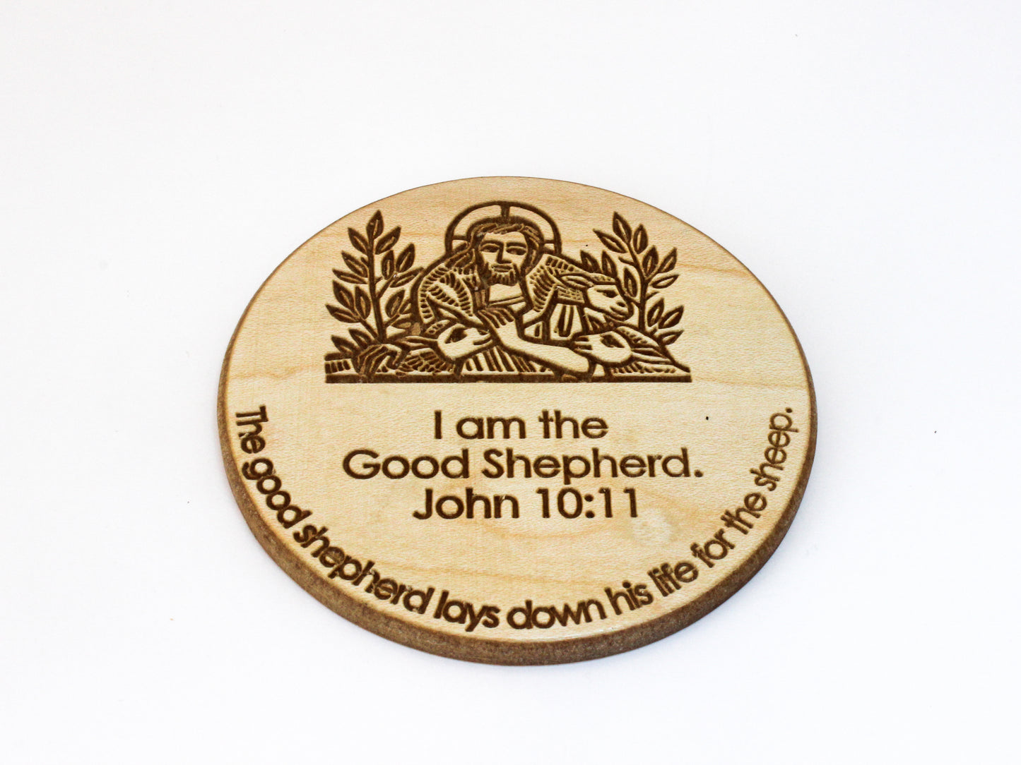 Wooden coaster featuring an image of Christ the Good Shepherd and the verse John 10:11: "I am the Good Shepherd. The good shepherd lays down his life for the sheep."