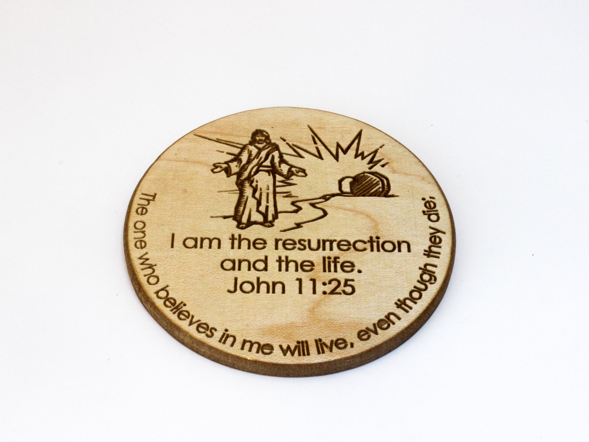 Wooden coaster featuring an image of the risen Christ and the text of John 11:25: "I am the resurrection and the life. The one who believes in me will live, even though they die."