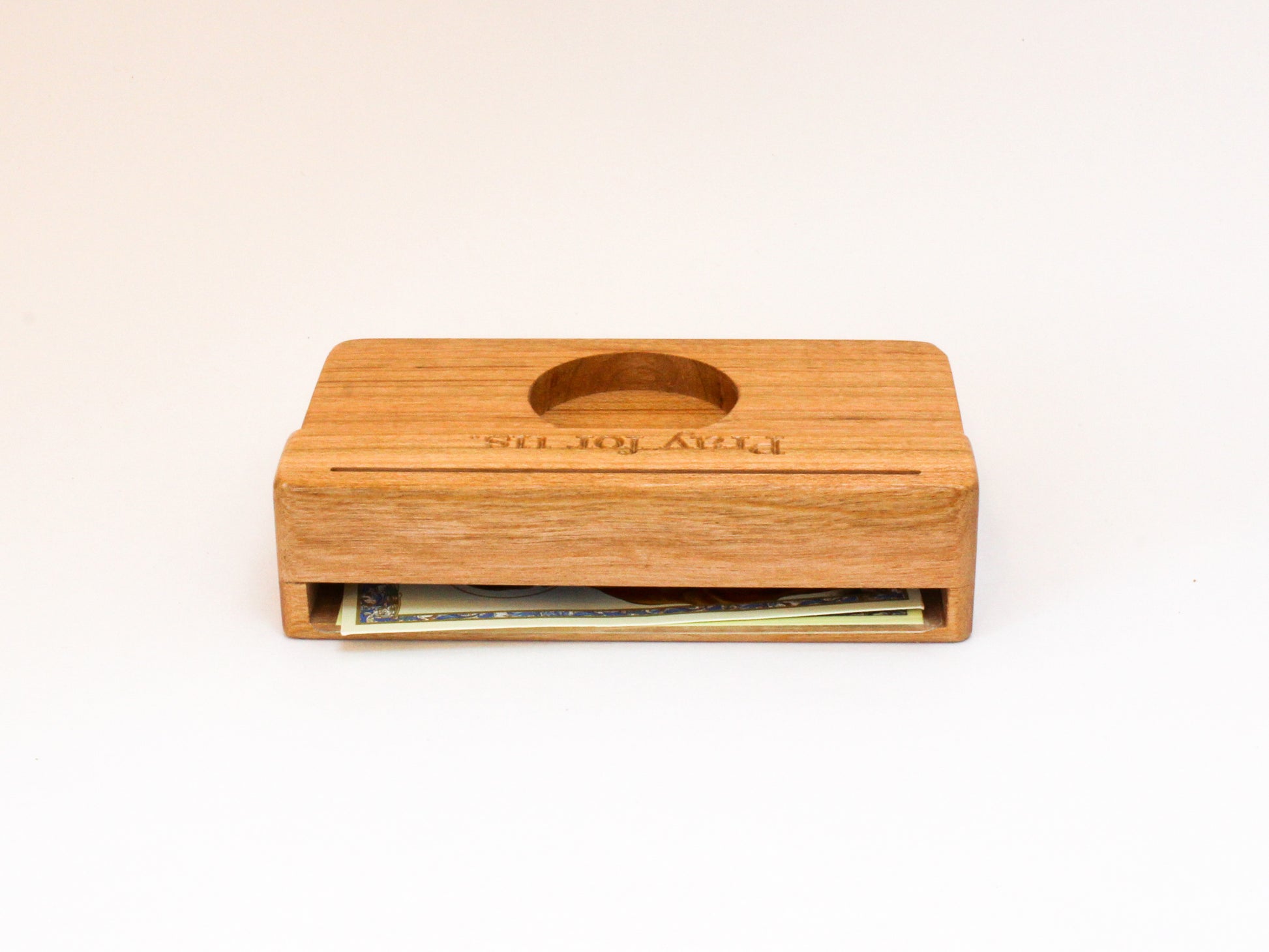 Back view of prayer card holder showing storage space for extra prayer cards