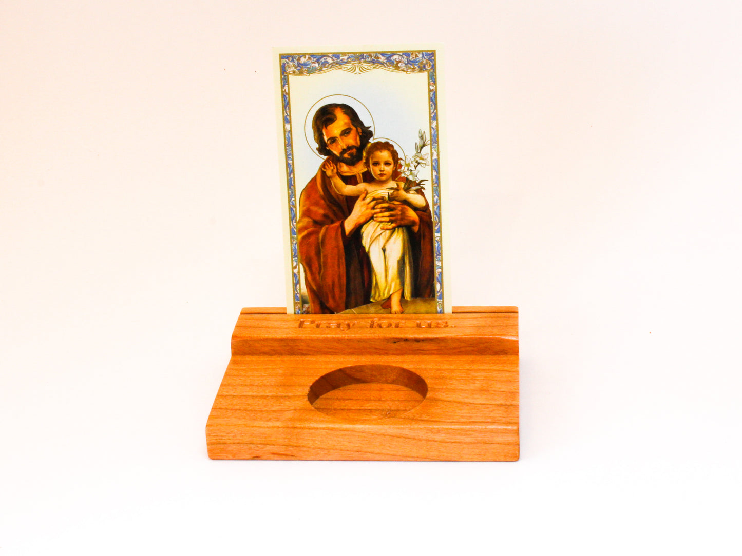 Small wooden prayer card stand for holding holy cards up with space for a votive candle in front.