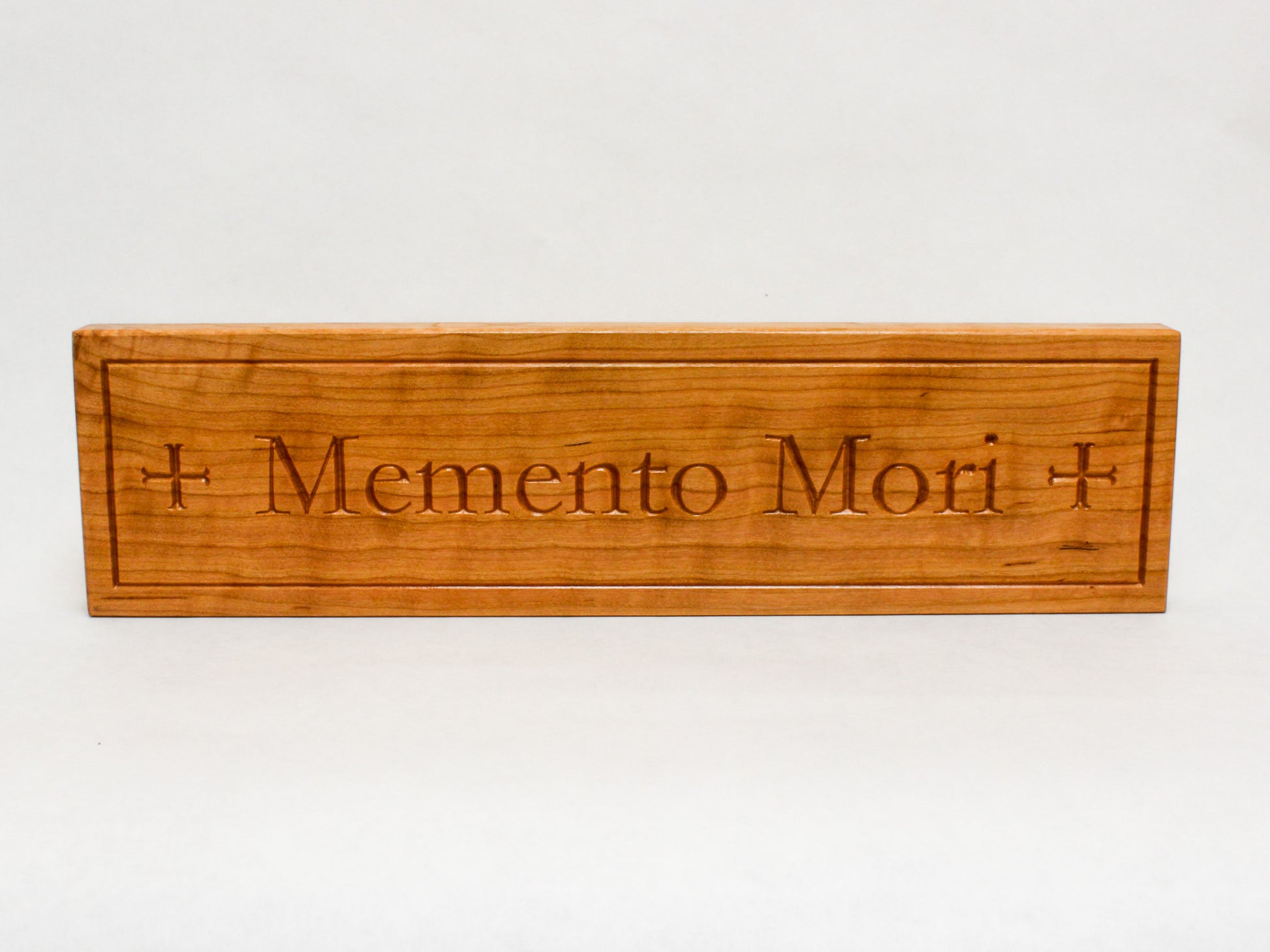 Wooden Lent Decoration: Memento Mori Sign engraved on free-standing wooden block featuring the moline cross on either side of the text
