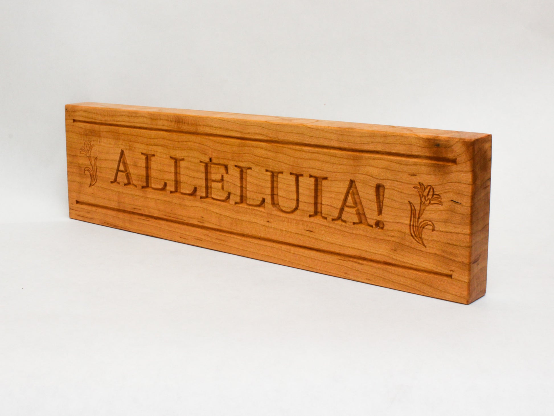 Side view of engraved Alleluia Easter sign to show thickness of wood